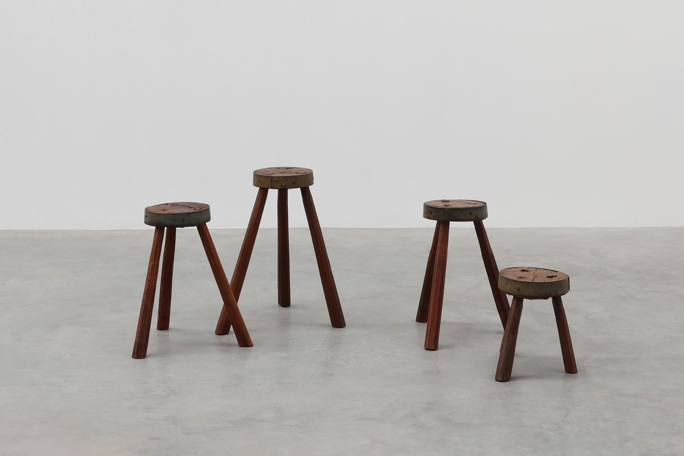 Brutalist French 1850s solid oak tripod stools with metal rim, set of 4thumbnail